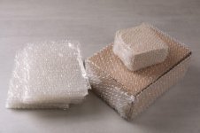 cardboard-boxes-bubble-wrap-light-grey-table_495423-45646.jpg